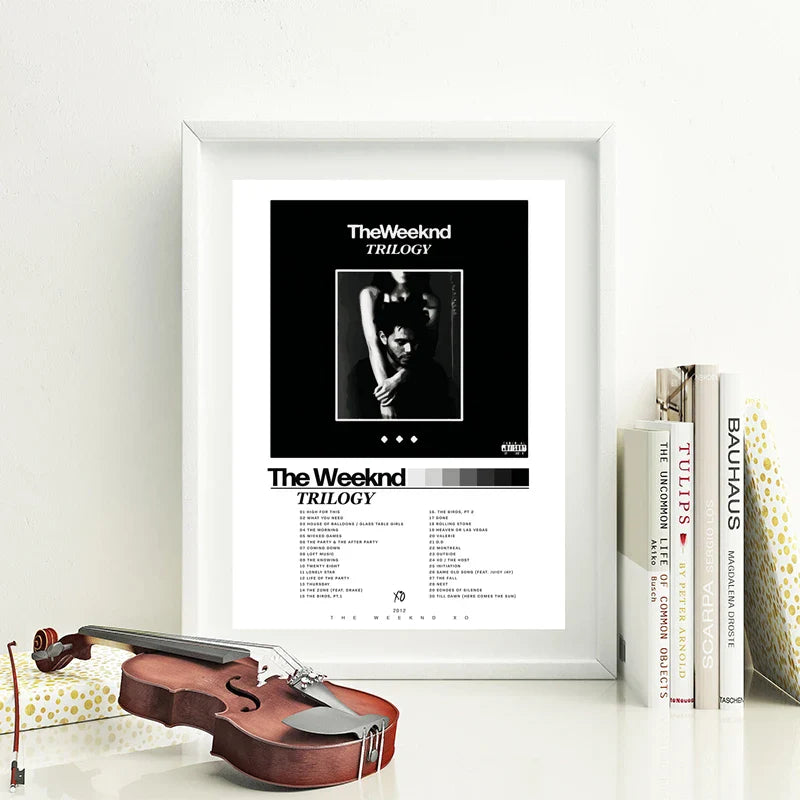 White-framed trilogy the weeknd album poster with black and white wall art featuring tracklist on clean white background