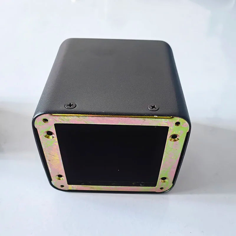 Black rectangular tube amplifier case with metallic gold base transformer cover and isolation shrouds with visible screws