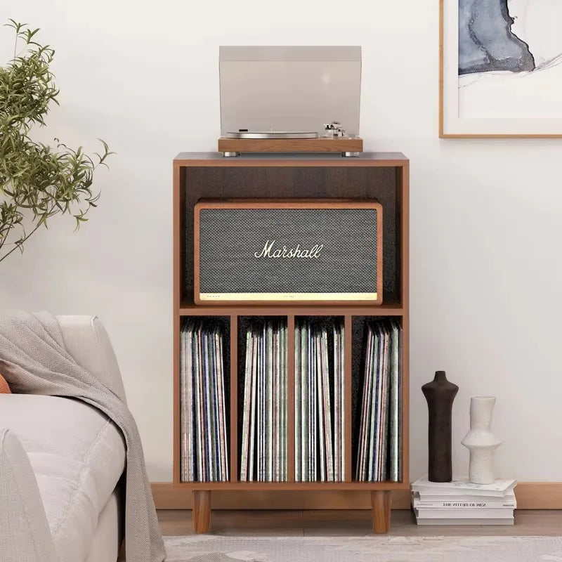 Marshall speaker with textured gray grille and gold trim on wooden media console turntable stand for music lover decor
