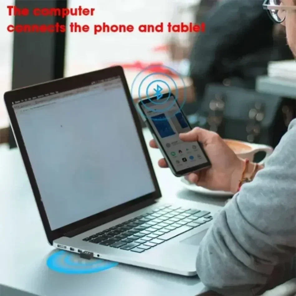 Silver laptop with black keyboard displaying a usb bluetooth 5.3 adapter transmitter receiver wireless usb adapter webpage