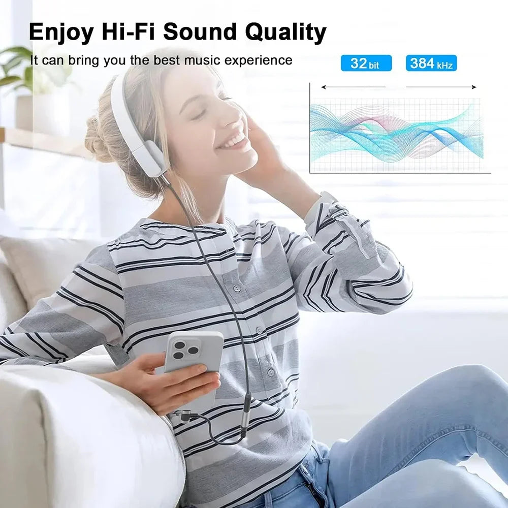 White over-ear headphones with black jack aux audio cable connected to a usb c audio adapter for iphone and samsung