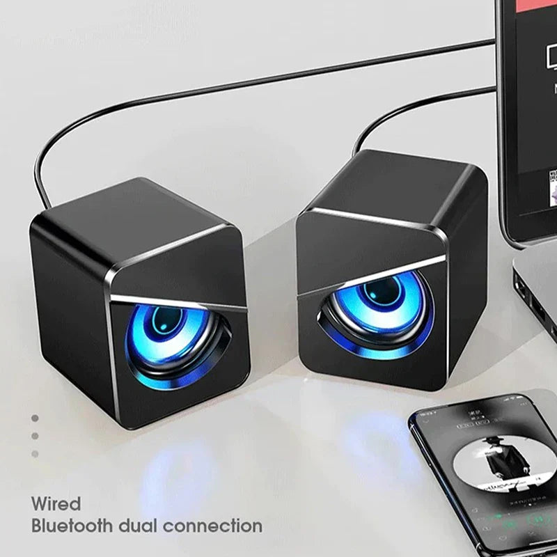 Black cube-shaped usb wired computer speakers with glowing blue surround sound led and gaming bass wired drivers