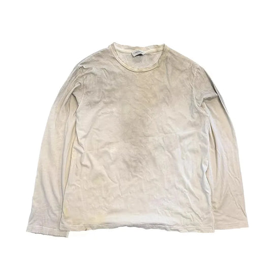 Worn off-white long-sleeved cotton vintage loose casual tee featuring faded texture for hip streetwear harajuku look