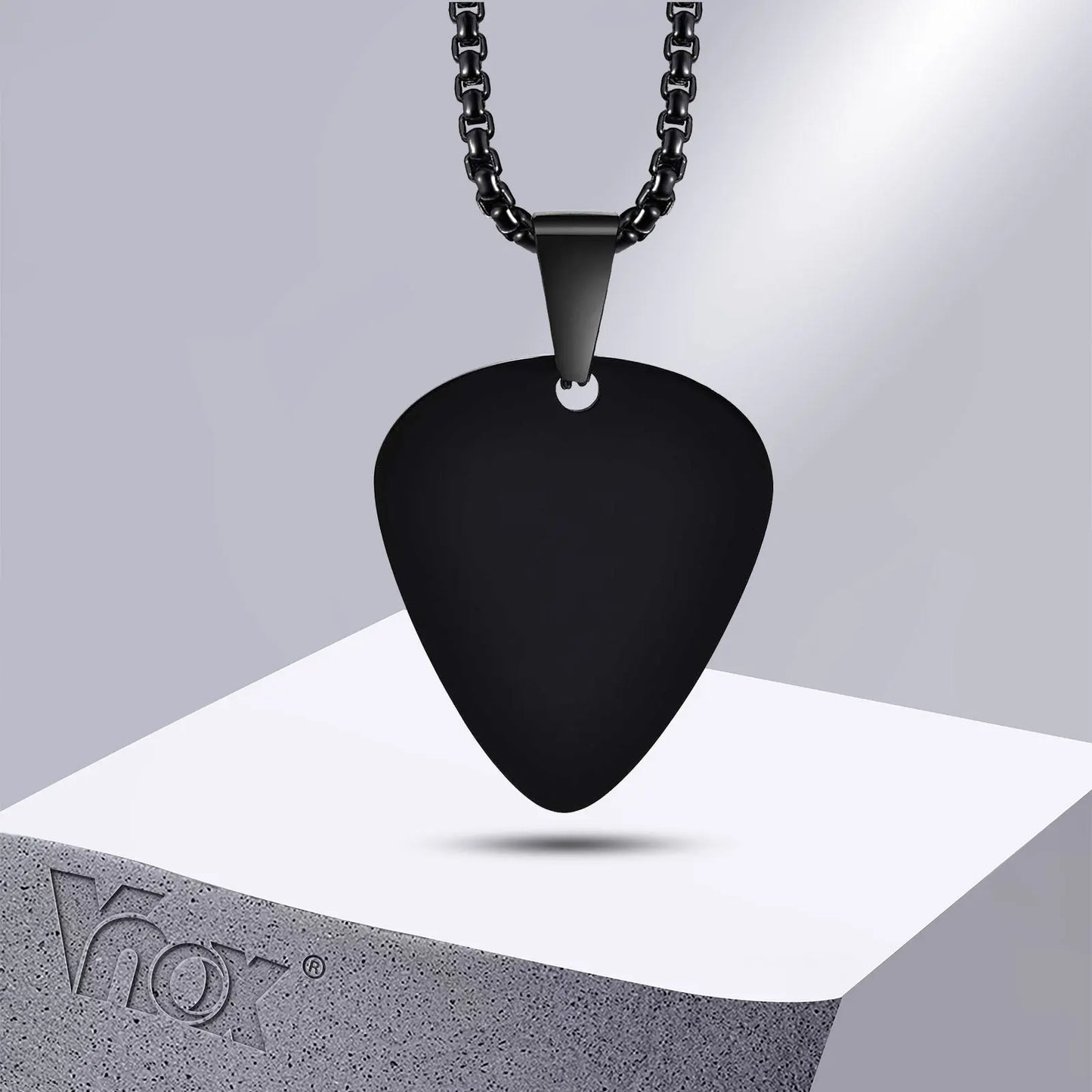 Black unique guitar pick necklace with matte finish on matching stainless steel guitar chain for music lovers