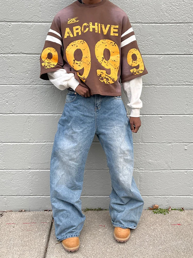 Brown archive 999 oversized sweatshirt with yellow distressed numerals and white striped sleeves in y2k hip hop style