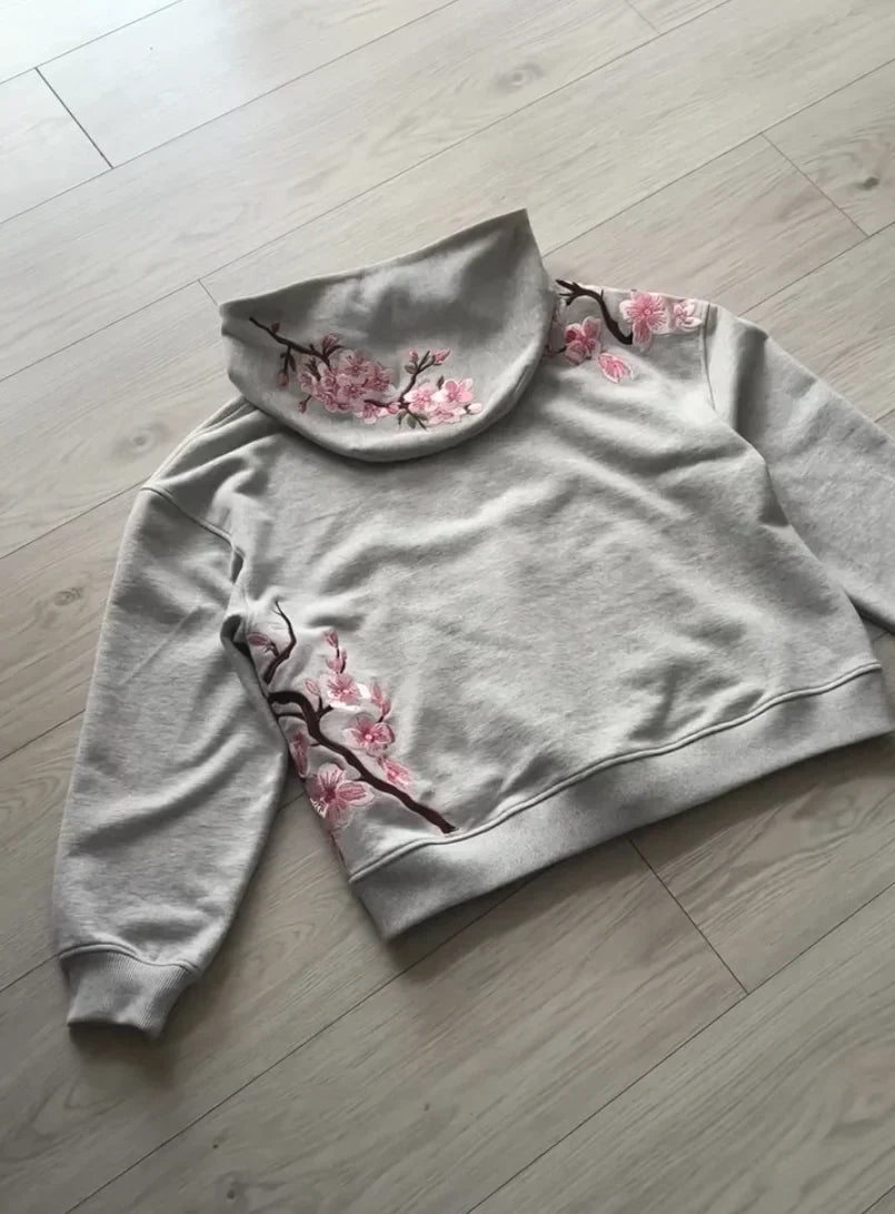 A soft gray y2k vintage oversized embroidered hooded jacket with pink cherry blossom details on collar and sleeves