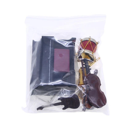 Miniature classical musical instrument set with black guitar red drum brown violin gold trumpet and dark wood cello in bag