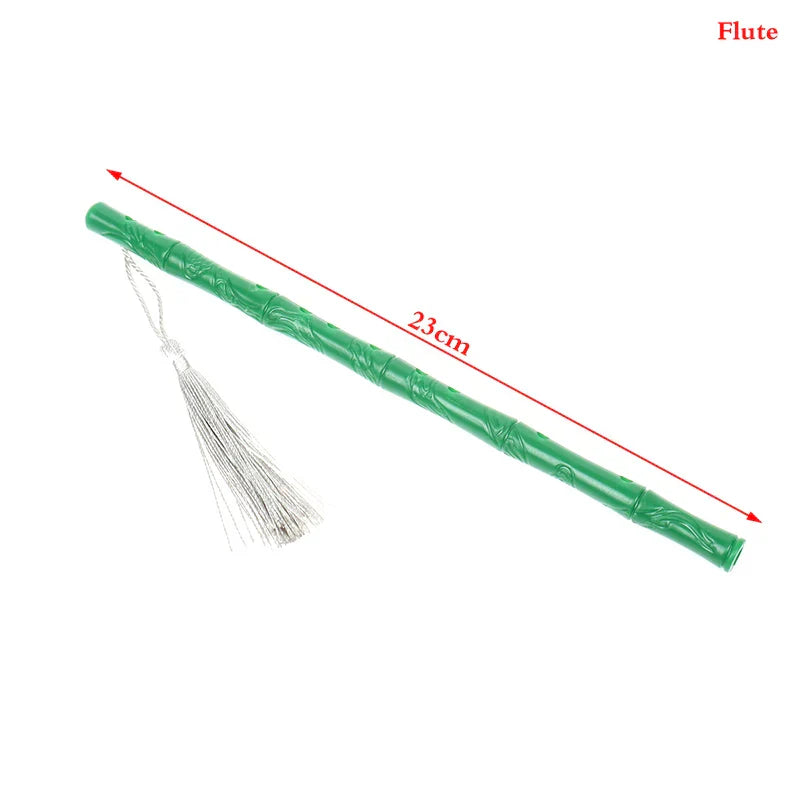 Green bamboo-style flute with intricate carvings and silver tassel in 1:12 dollhouse miniature furniture playset model living room accessory