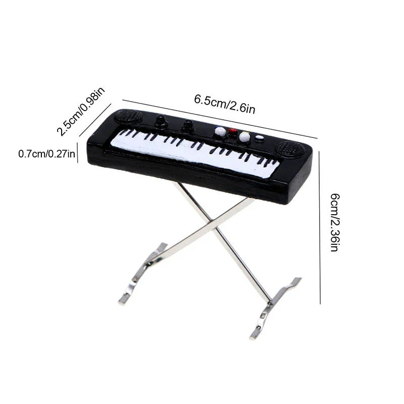 Black miniature keyboard with white keys and silver metal stand in 1:12 dollhouse miniature furniture playset for model living room