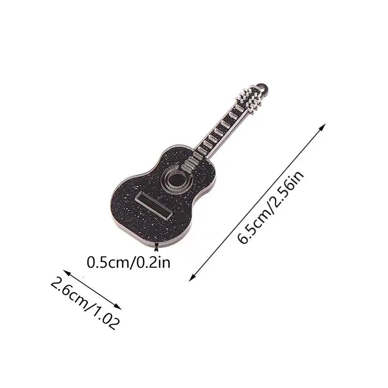 Black glitter guitar-shaped pin with silver-toned details and metallic finish for dollhouse miniature furniture decor