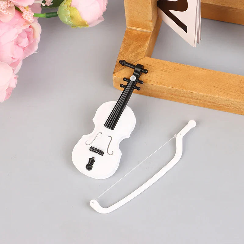 White miniature violin with black accents and matching bow in 1 12 dollhouse miniature furniture playset model living room decor