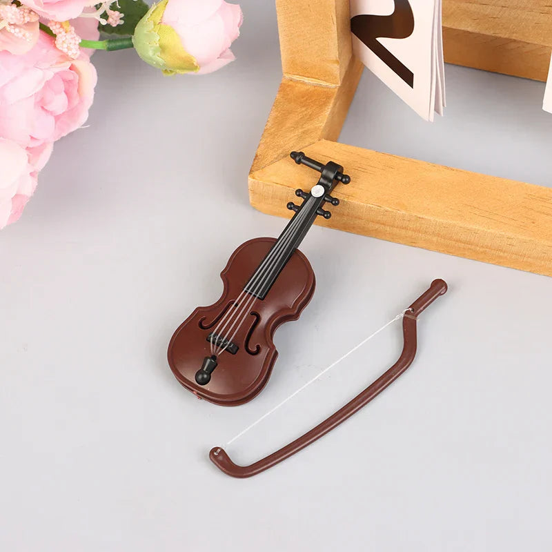 Brown plastic miniature violin with black strings and bow for dollhouse miniature furniture playset model living room decor