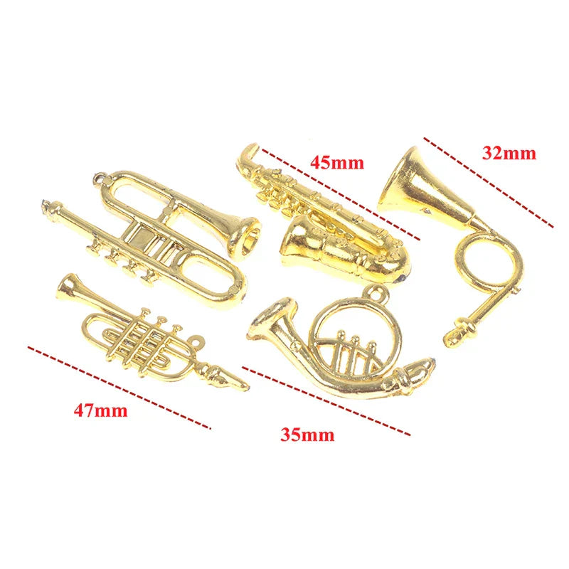Gold-colored miniature brass instrument charms including trumpet saxophone and french horn for dollhouse miniature furniture playset