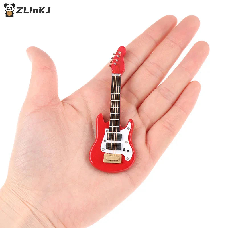 Red miniature electric guitar model with white pickguard and black fretboard for dollhouse miniature music toy