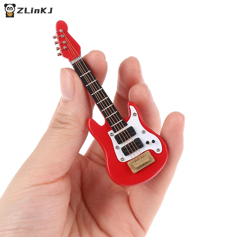 Red miniature electric guitar model with white pickguard and black pickups held in hand for dollhouse miniature music and kids musical toy