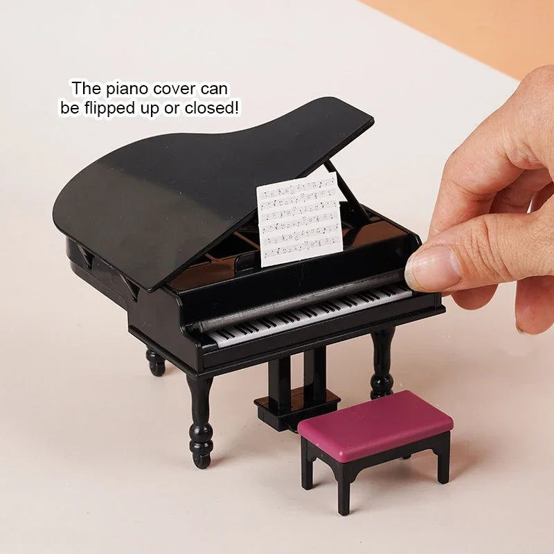 Black glossy miniature piano with white and black keys, small music sheet, and purple cushioned stool for dollhouse decor