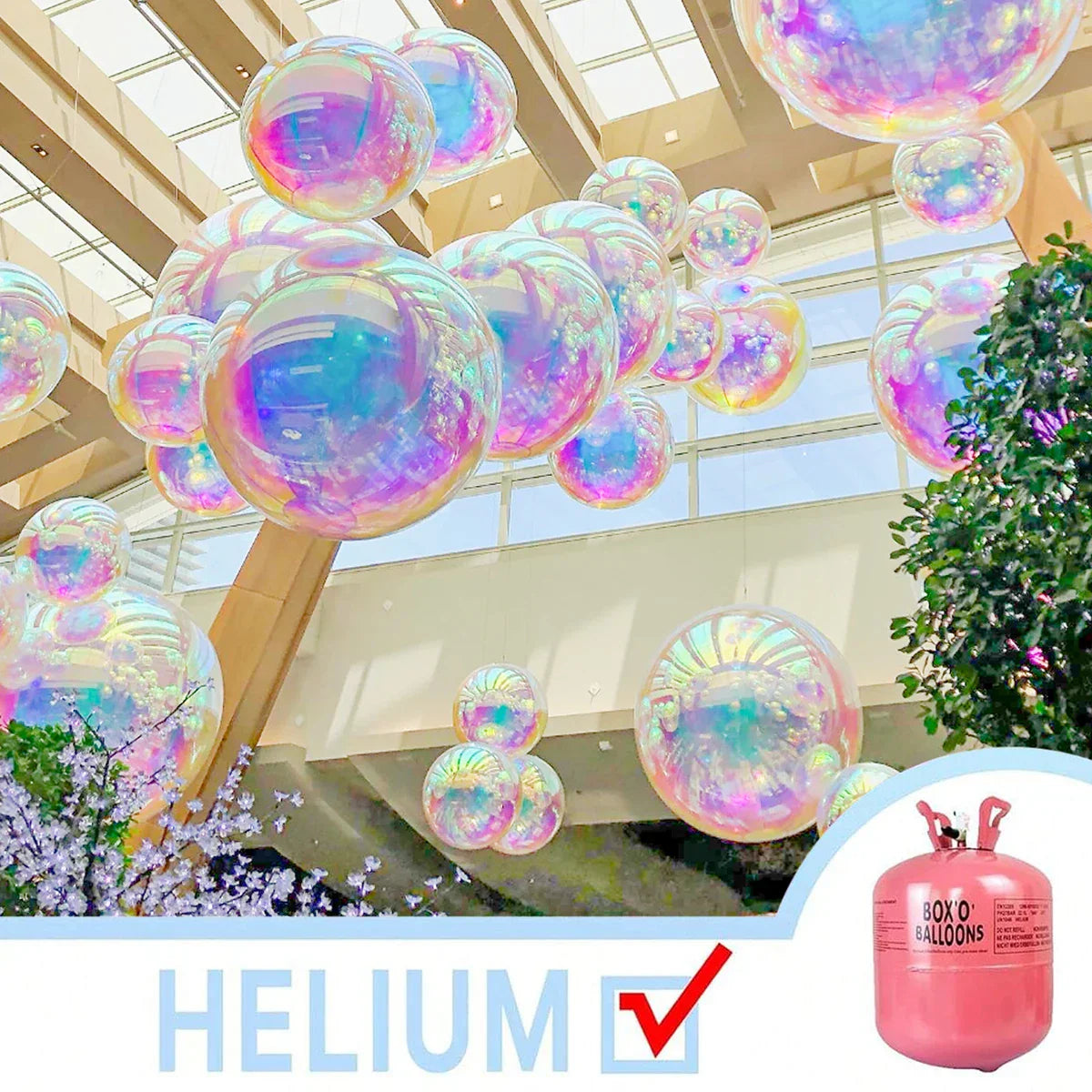 Iridescent transparent color 4d holographic balloons floating in a modern atrium for birthday party music and wedding supplies