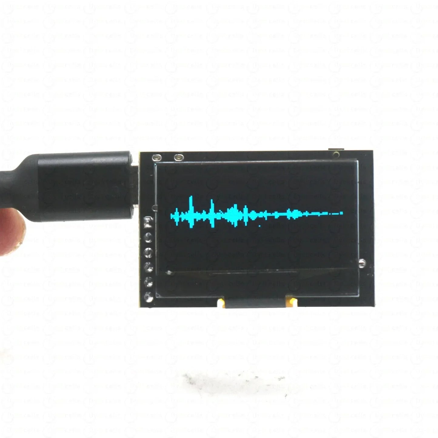 Black rectangular lcd module with cyan audio waveform on screen for 1.3-inch oled music spectrum voice controlled microphone