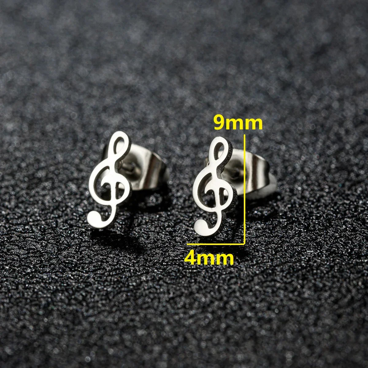 Silver stainless steel mini music earrings featuring a sleek charm musical note design as small ear studs for women