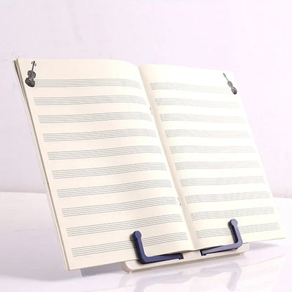 A sleek dark blue lightweight adjustable portable music stand with durable plastic construction holding sheet music for music score drawing