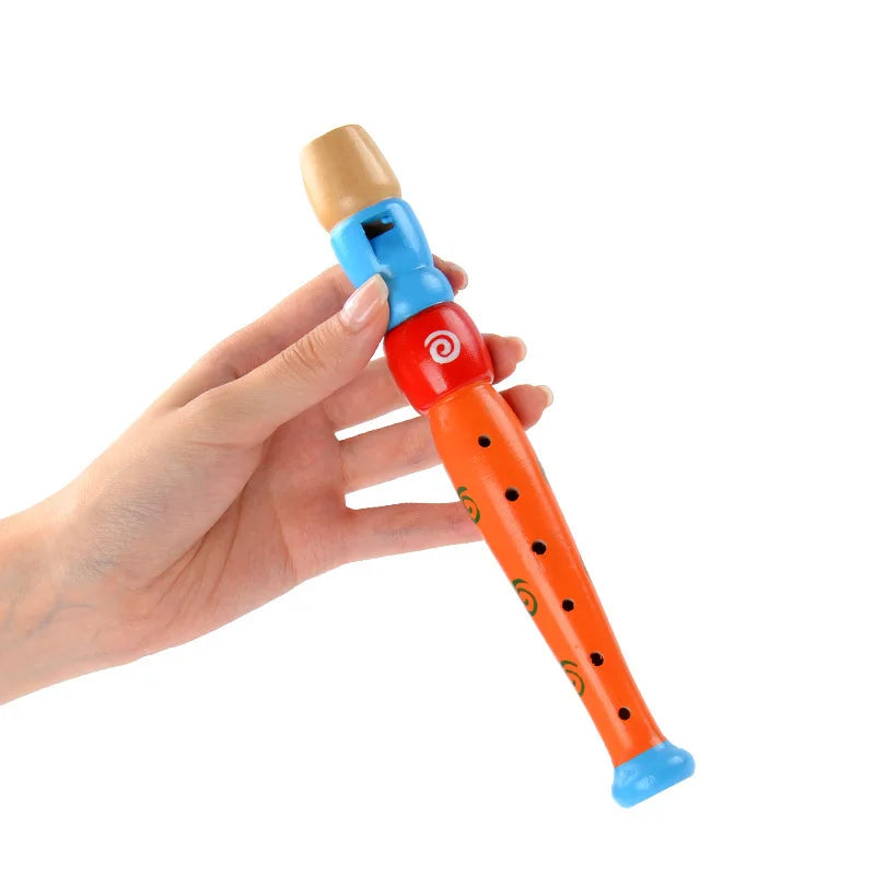 Bright orange wooden colorful piccolo flute with blue mouthpiece and green spiral patterns for kids learning rhythm