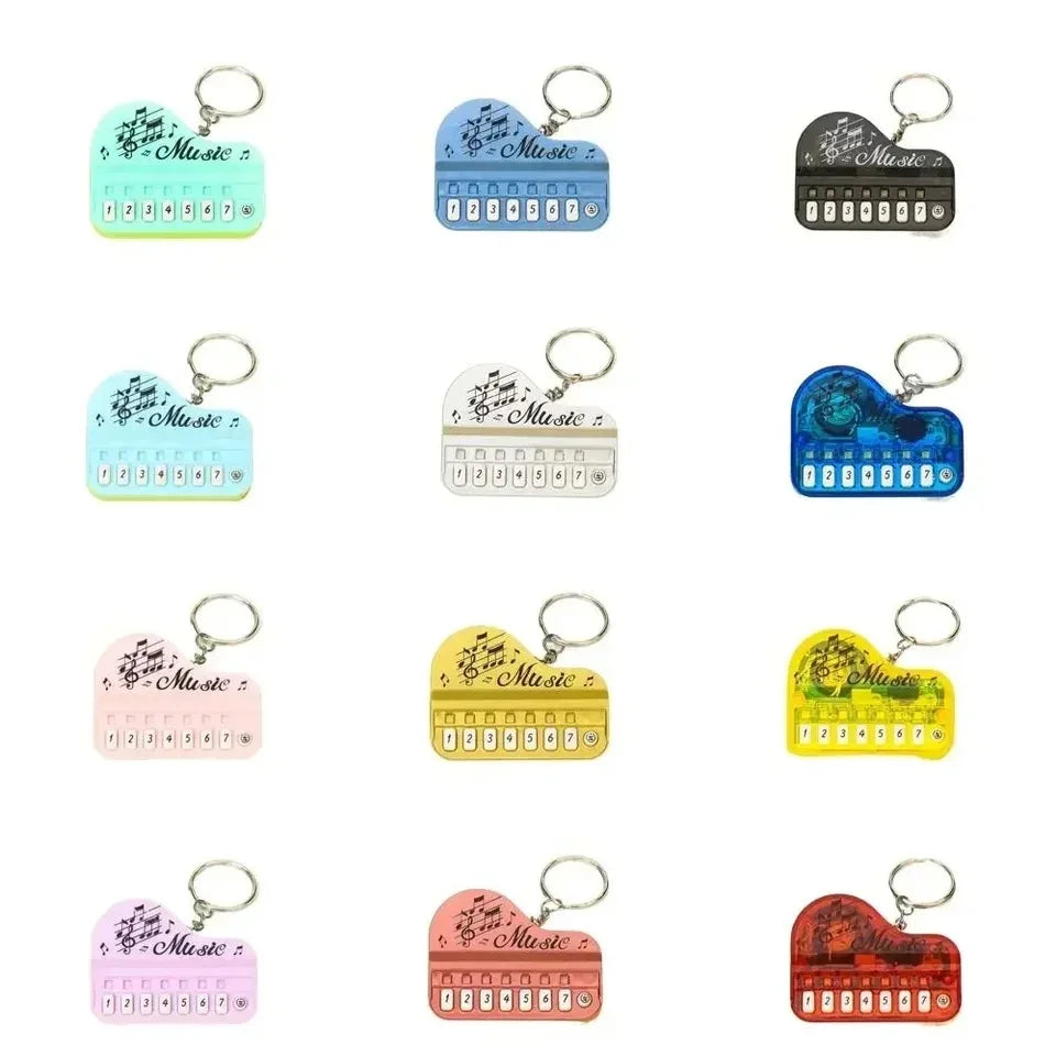Colorful luminous music toy mini electronic piano keychain pendant in heart shapes with musical notes and number keys