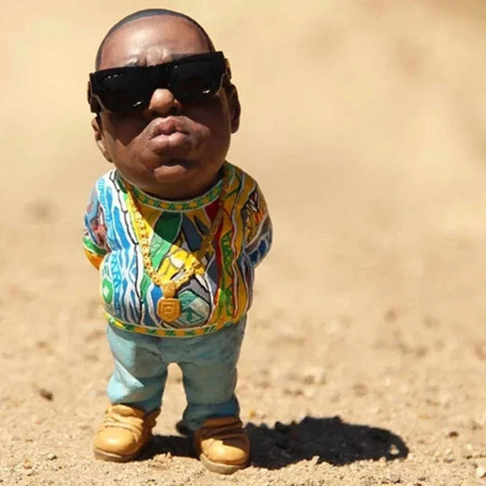 A detailed hip hop legend commemorative resin ornament figurine featuring a rapper with sunglasses and colorful attire
