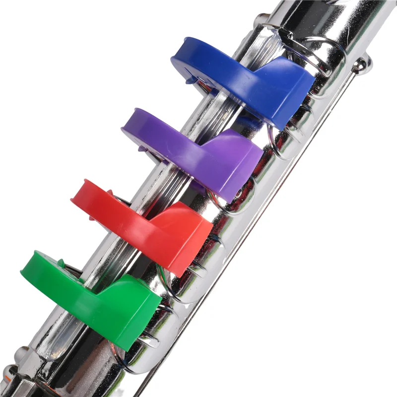 A shiny chrome musical instruments brass flute with colorful blue purple red and green plastic key covers wind instrumentabht