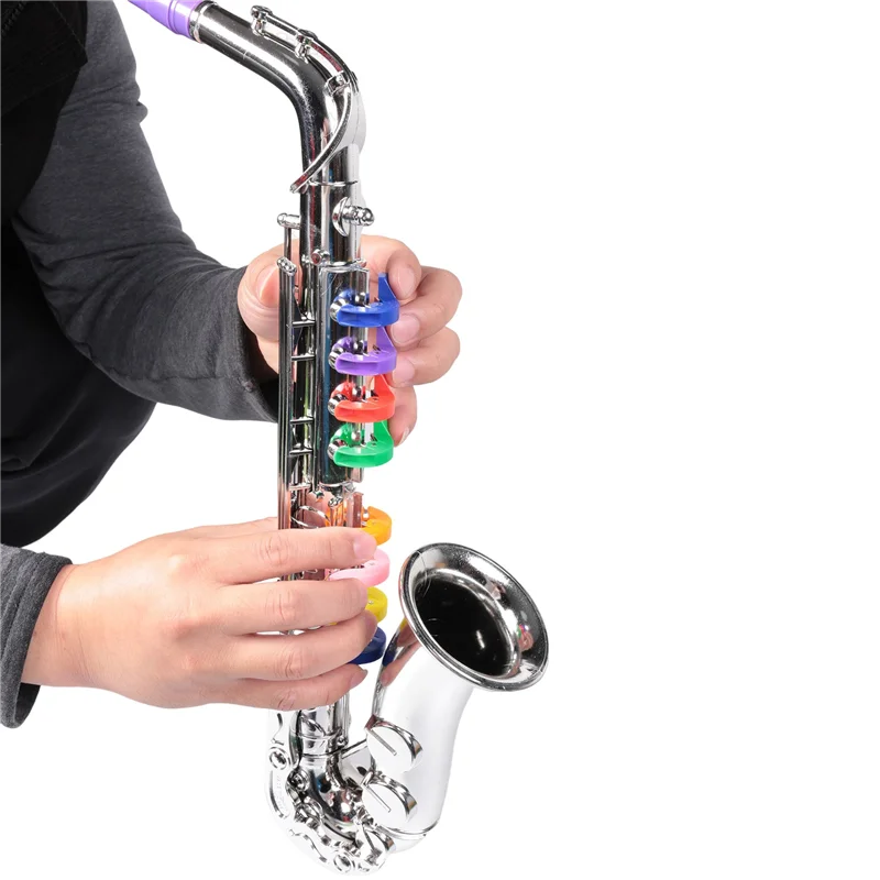 A shiny silver musical instruments brass saxophone with rainbow plastic key covers designed for children wind instrumentabht