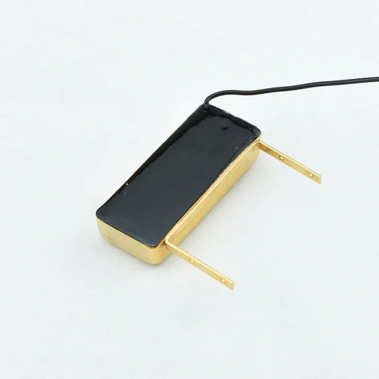 Gold-plated rectangular jazz guitar pickup with black magnetic core and brass tabs for floating archtop type beat music