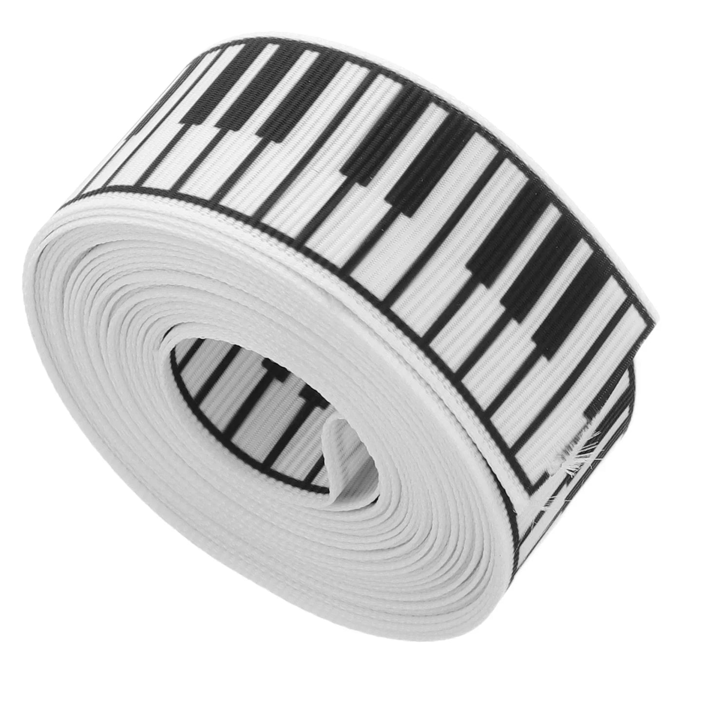 A roll of white elastic ribbon with black and white piano keys perfect for wedding diy present wrapping floral bouquet birthday party decorations