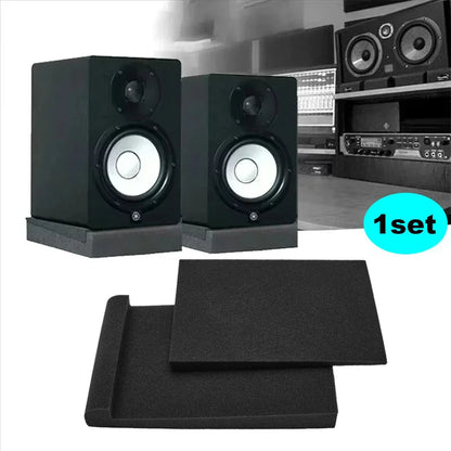 Black yamaha studio monitor speakers with silver cones and high density black foam isolation pads for soundproofing