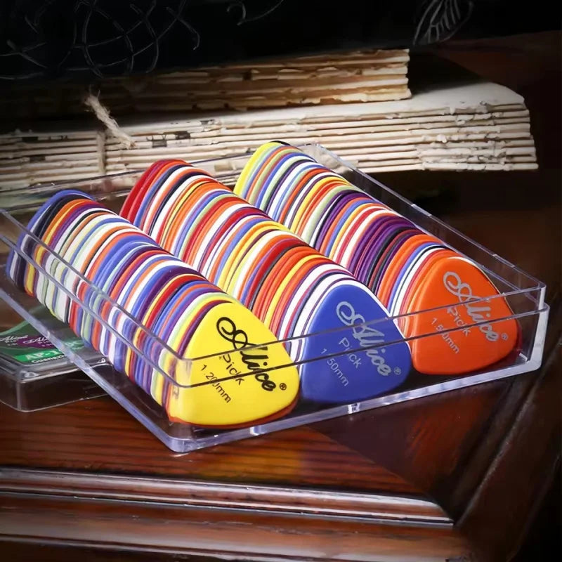 A vibrant collection of colorful elixir guitar pick original sound with bold stripes in a clear plastic tray for electric bass moderator