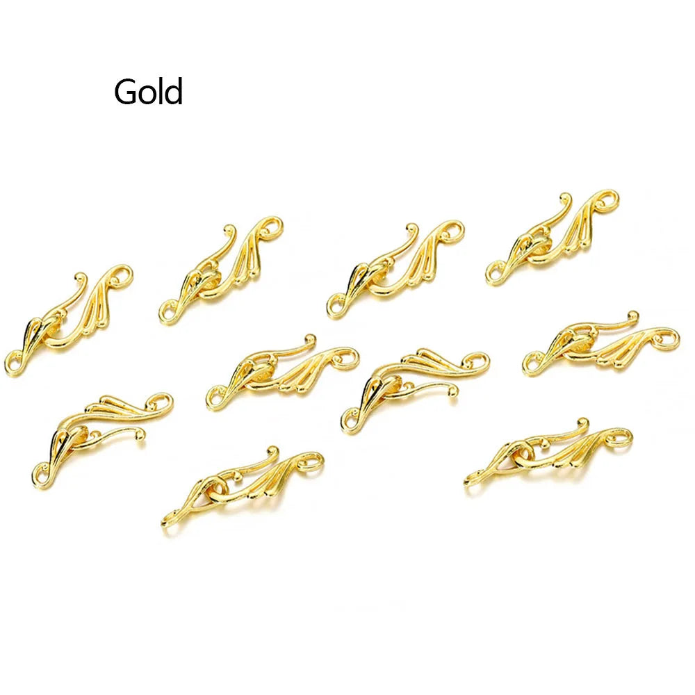 Gold-colored ornate metal clasps with intricate scrollwork ideal for jewelry making antique bronze silver musical note hook