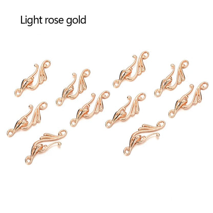 Light rose gold ornate metal clasps with symmetrical scrollwork for jewelry making antique bronze silver musical note hook