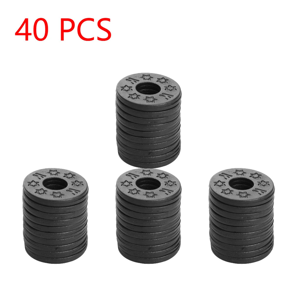Black circular metal washers with star patterns for lightweight rubber guitar strap locks on acoustic electric guitar bass
