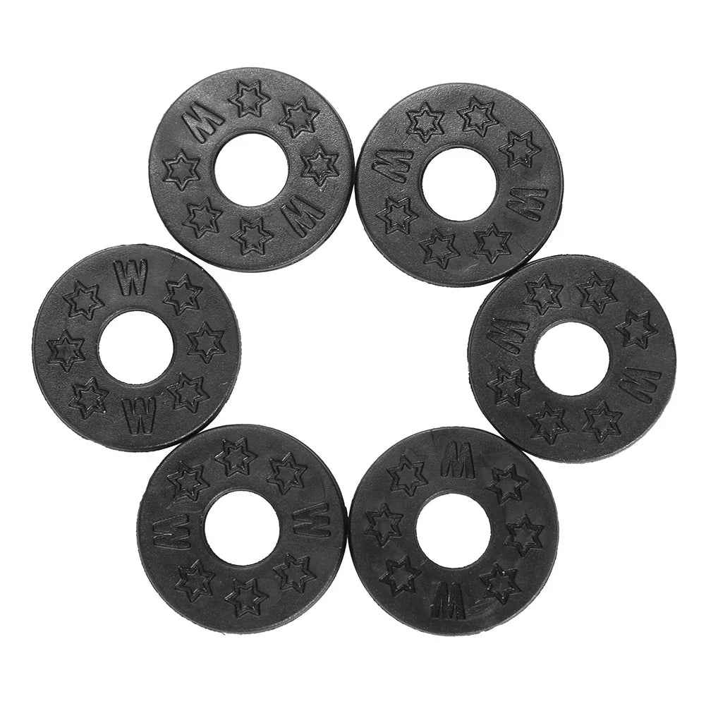 Black circular rubber magnetic guitar strap locks with embossed star and letter patterns for acoustic electric guitar bass