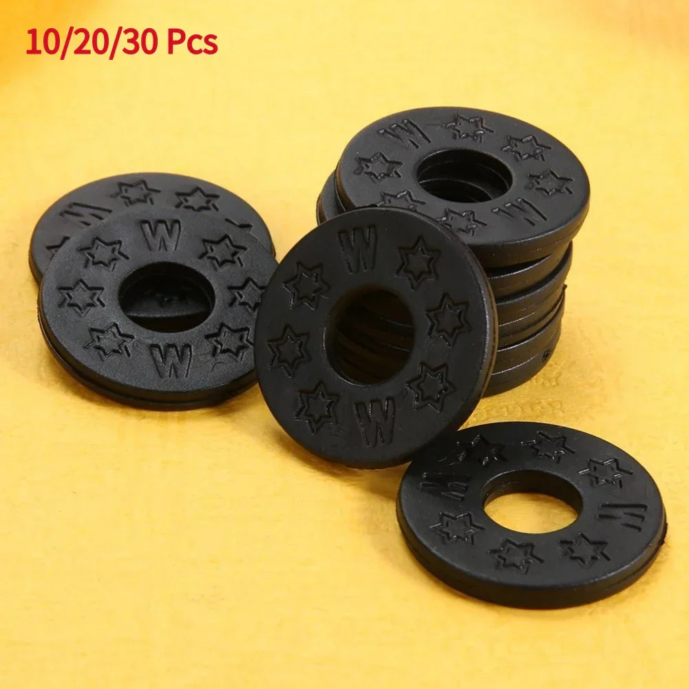 Black circular rubber guitar strap locks with star and w embossed designs for acoustic electric guitar bass use