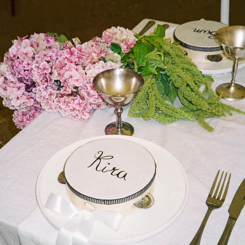 White wedding tambourines with black cursive lettering and metallic accents adults hand drums for parties and church use
