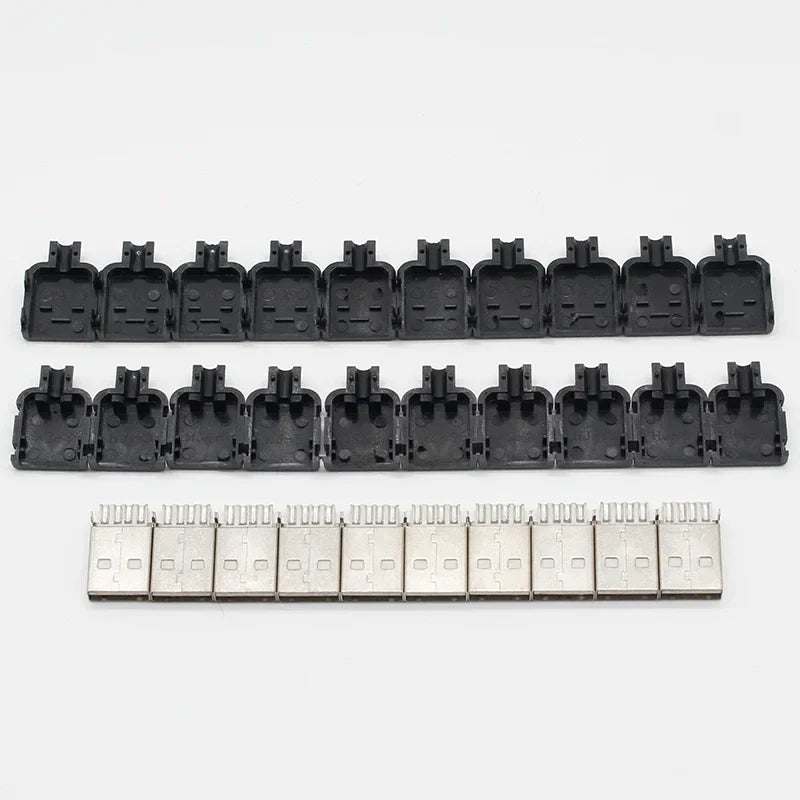 Black plastic usb 2.0 a type male connector housings and silver metal 4 pin plugs arranged in rows for data connection