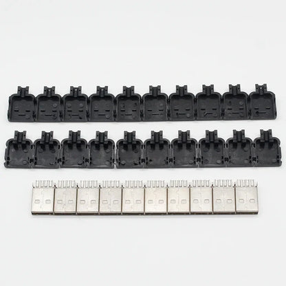 Black plastic usb 2.0 a type male connector housings and silver metal 4 pin plugs arranged in rows for data connection