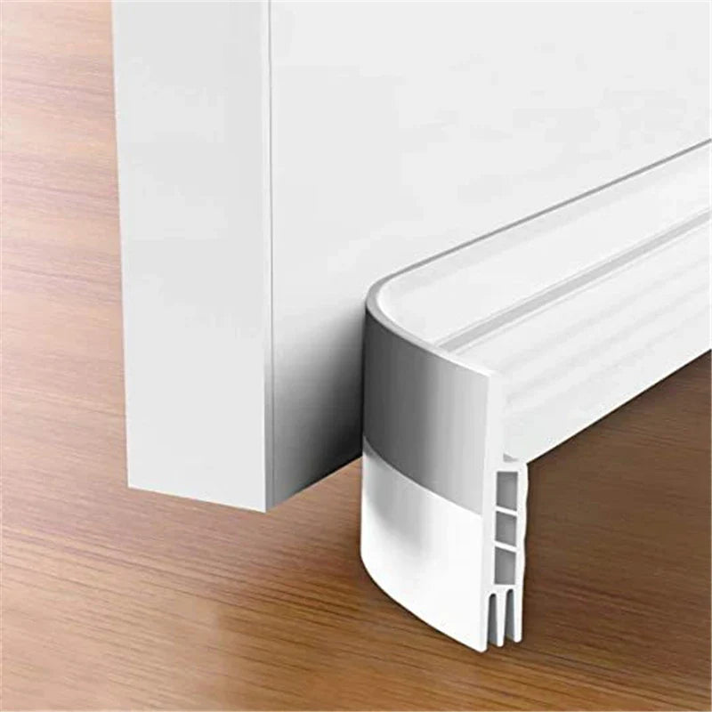 White plastic high quality 100cm silicone door draft stopper with curved design and silver metallic edge strip