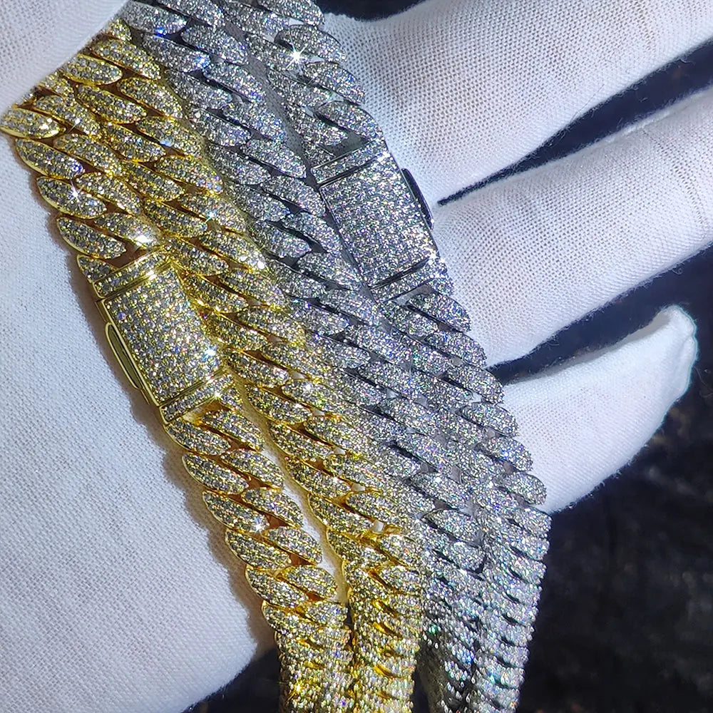 Two sparkling pave-set 10mm hip hop bubbles cuban link chain necklaces in gold and silver on a white-gloved hand birthday personalized gift