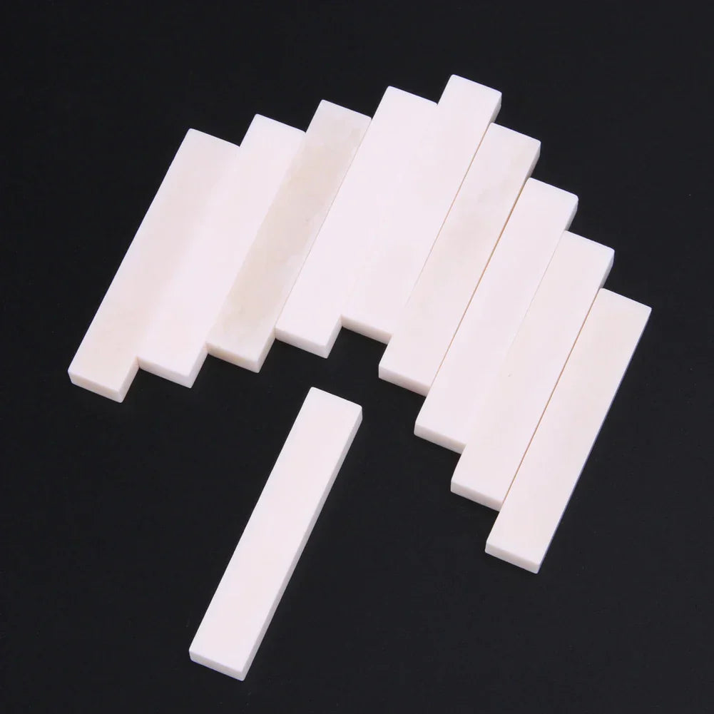 Set of 10 white rectangular guitar blank bone nuts made of durable buffalo bone for professional musical instrument use