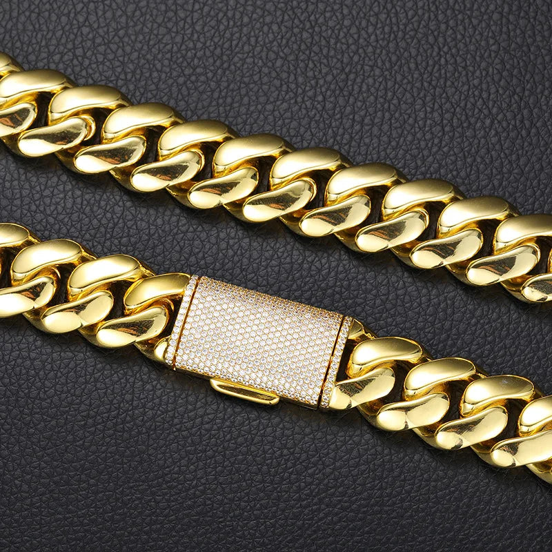 Gold-colored wide hip hop round Cuban Miami link chain with diamond-encrusted rectangular clasp men rapper jewelry