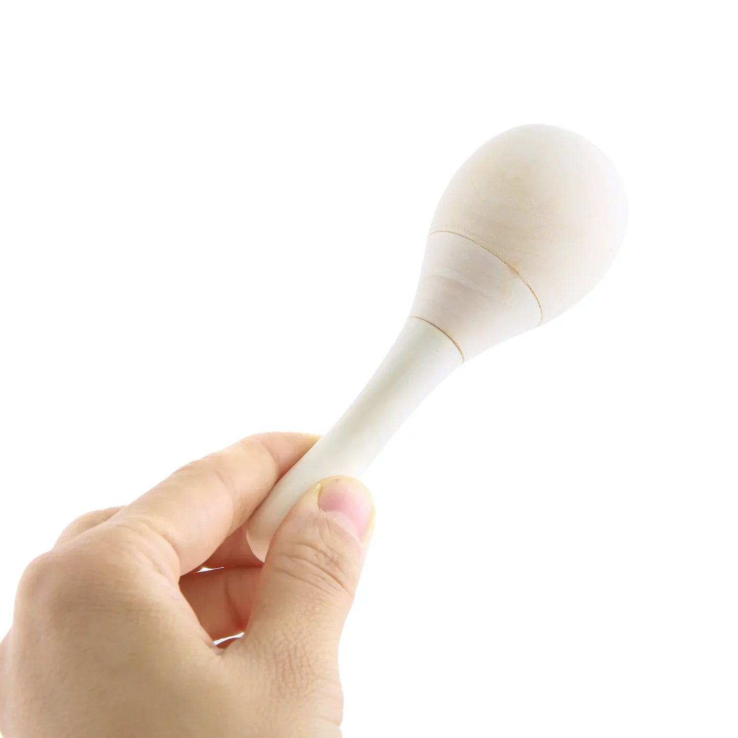 A smooth off-white wooden maraca held gently showcasing adults hand percussion rumba shaker maracas instrument