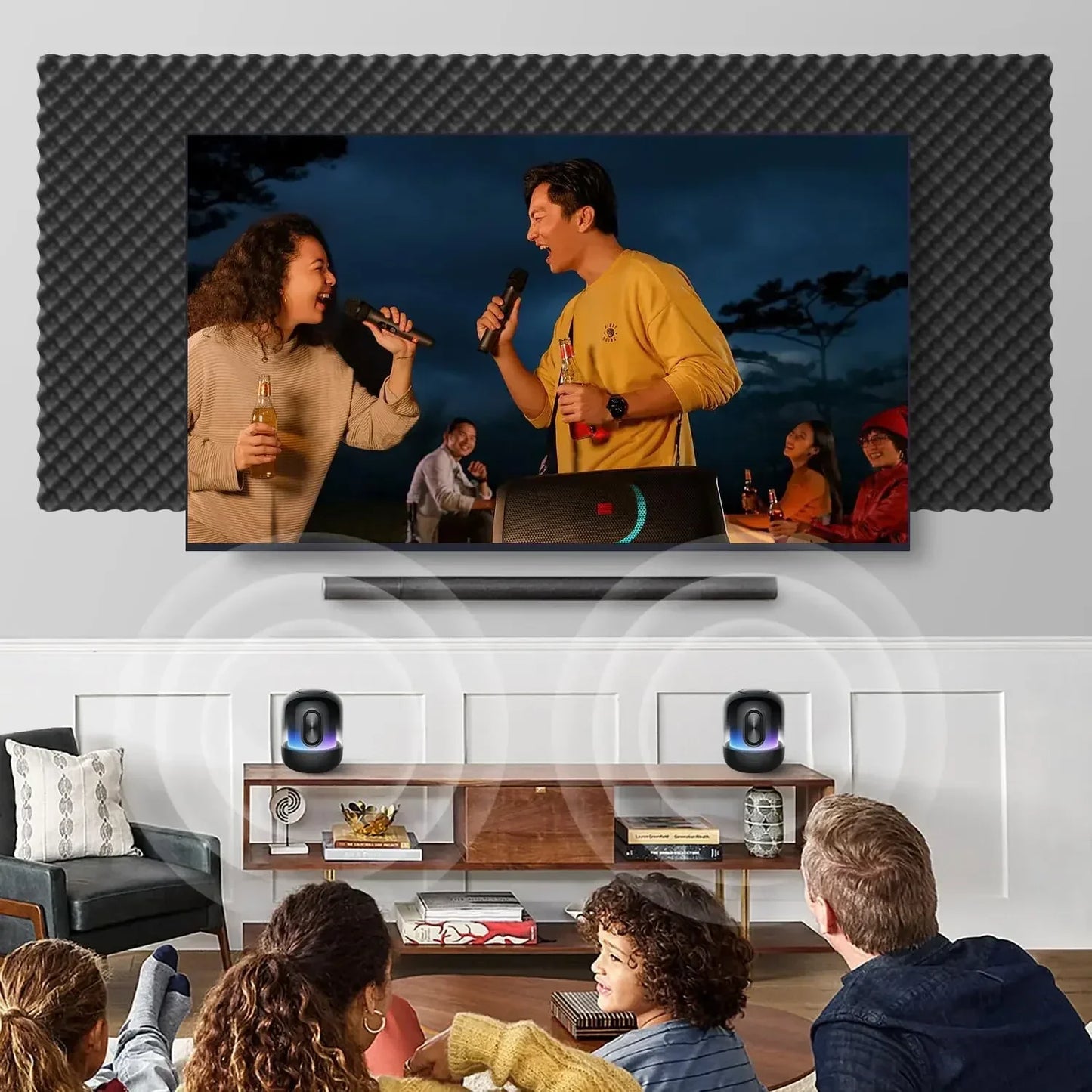 Black soundbar with sleek modern design and blue accents displayed alongside soundproof wall panels acoustic foam tiles for home studio bedroom noise reduction