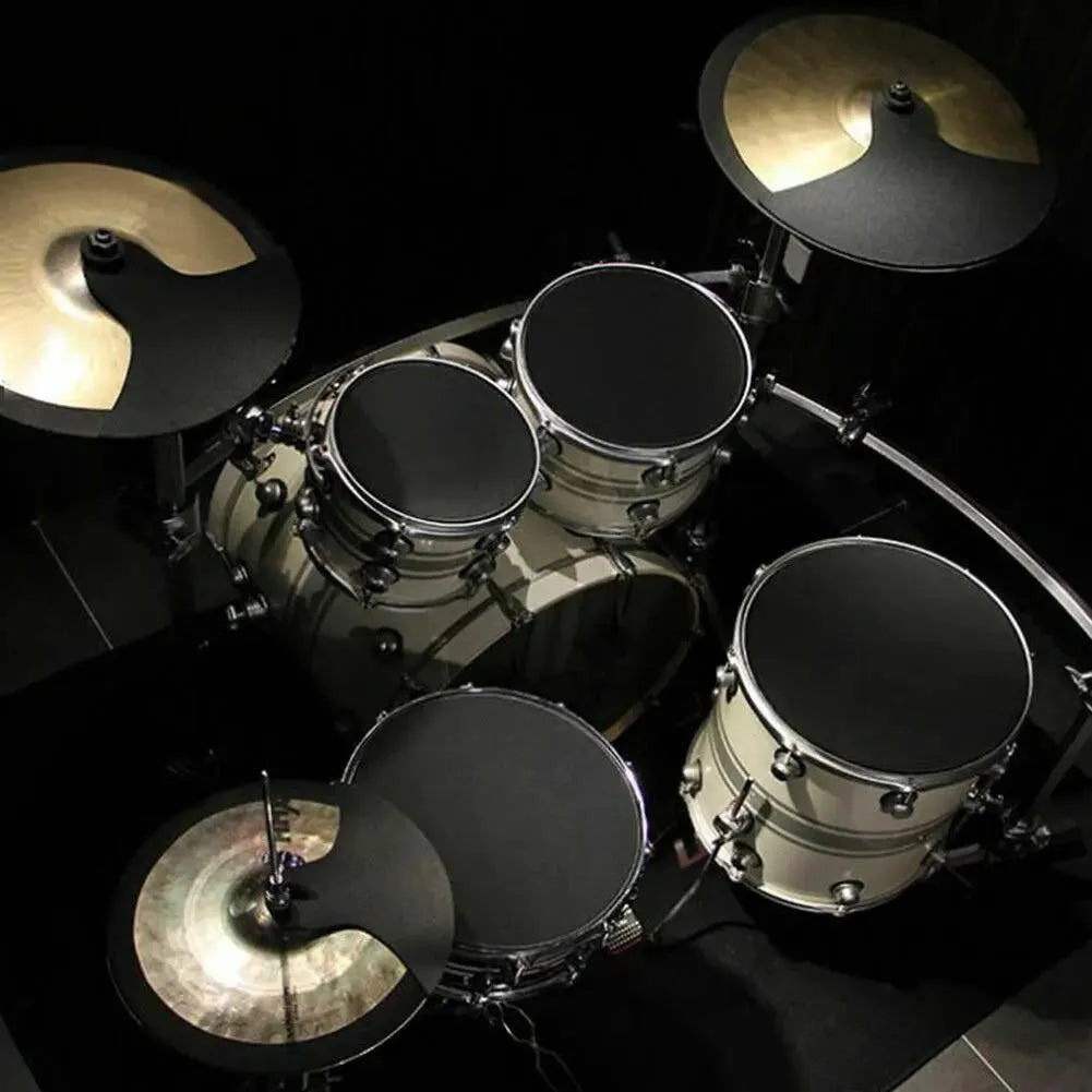 Cream-colored drum set with black drumheads and shiny brass cymbals featuring 14pcs drum mute pads for practice