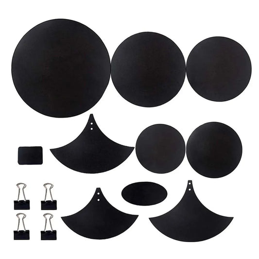Set of black circular and crescent-shaped drum mute pads made of sponge with matching binder clips for drumming practice