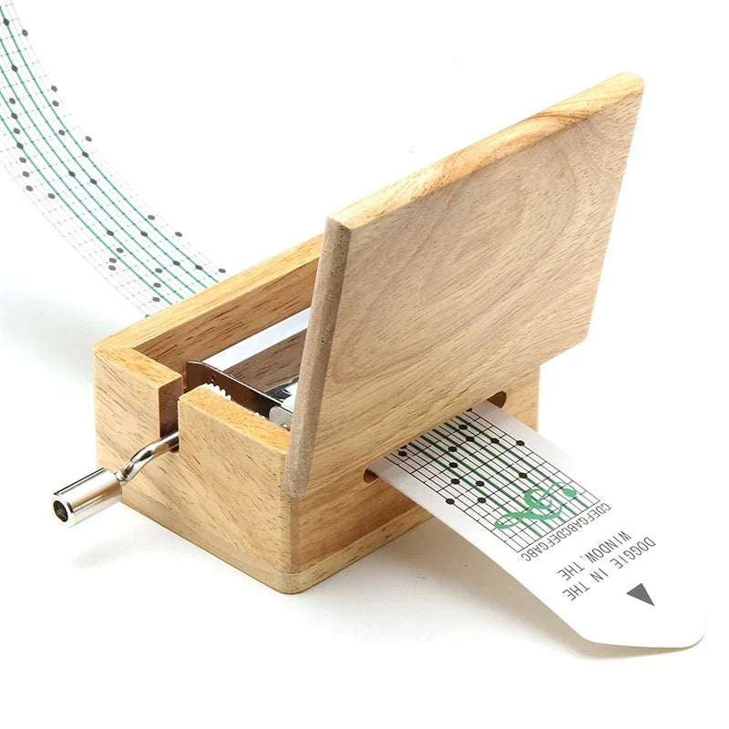 Light-colored wooden 15/30 tone hand-cranked music box with paper tape puncher and green music paper composing movement creative diy